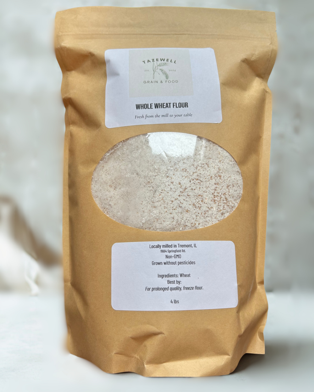 Bag of whole wheat flour with a visible brand label. 